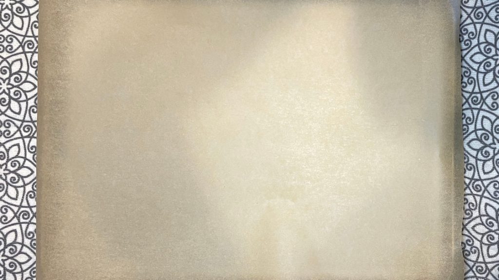 Parchment Paper on Stainless Steel Baking Sheet for Homemade Granola Recipe
